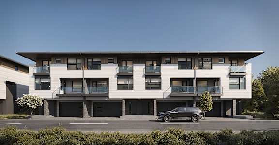 A modern building with a car parked in front.