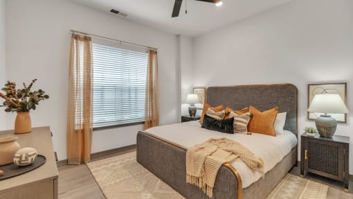 a bedroom with a large bed and a window at Slate at Fishers District, Fishers, IN