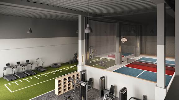 A gym with a variety of equipment including treadmills, weights, and a boxing ring.
