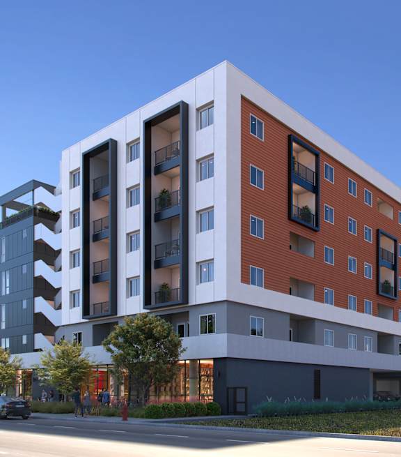 A modern multi-story building with a mix of red and white colors.
