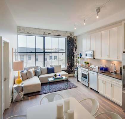 a rendering of a living room and kitchen in an apartment