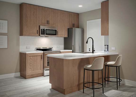 a kitchen with white cabinets and a granite counter top