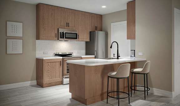 a kitchen with wooden cabinets and a counter with two stools