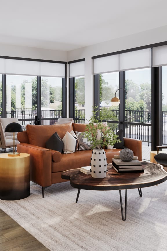 a living room with a brown couch and a table
