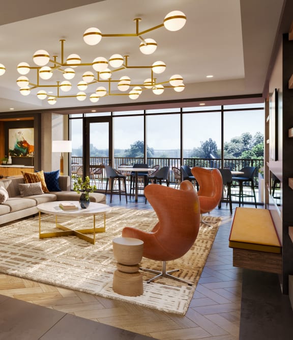a living room filled with furniture and a large window