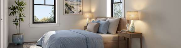 A bedroom with a bed, nightstand, and a plant.