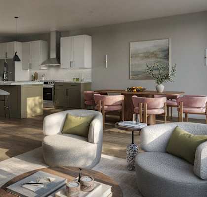 A modern living room with a kitchen in the background.
