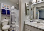 Thumbnail 8 of 15 - a bathroom with a sink and a toilet and a shower at Summers Point Apartments, Glendale, AZ
