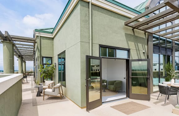 A modern house with a glass door entrance and a patio area at Vendome Place, San Jose, CA 95110