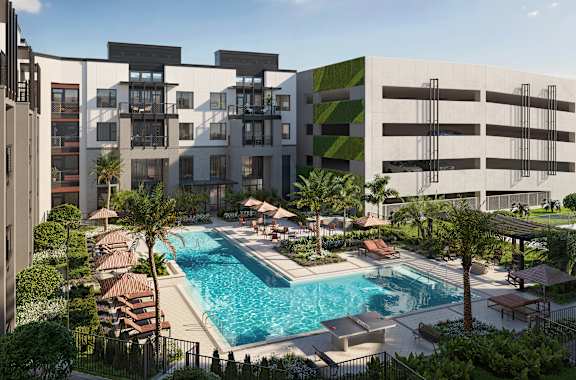 A modern building with a pool in front.