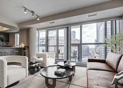 A modern living room with a view of the city.