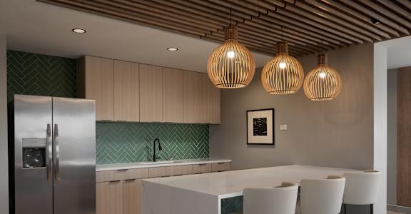 A kitchen with a white island and a refrigerator at The Park Apartments, Cleveland , OH