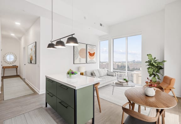 an open floor plan with a kitchen island and a living room with a large window