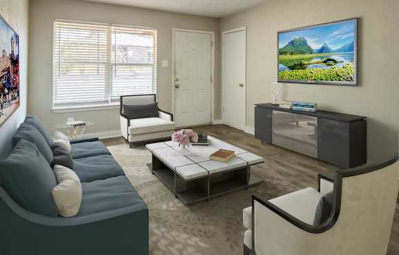 A living room with a grey chair and a wooden table.