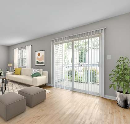 a living room with a couch and a table at West Pointe Apartments, Burlington, 27215