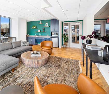 a living room with a gray couch and a coffee table