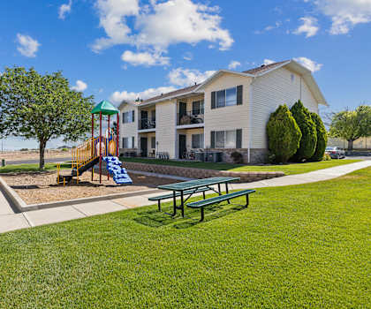 our apartments are equipped with a playground and picnic table