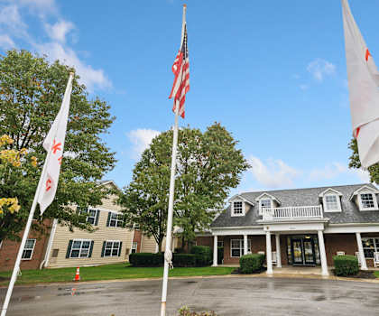 A building with a flag in front of it.