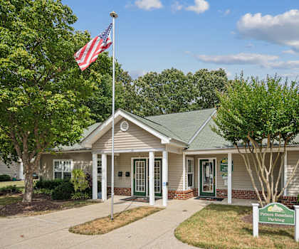 a white building with an flag in front of it