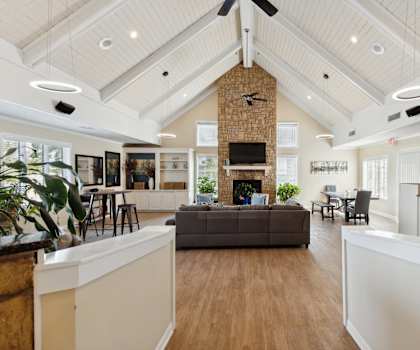 a large living room with a couch and a fireplace