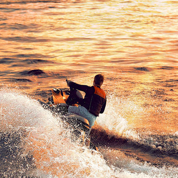 Man on jetski at The Villas at Sand Lake Resort, Sturgeon Lake, MN