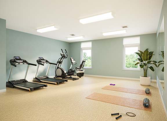 A room with exercise equipment and a plant. at Heritage Landing Apartments, Terre Haute, 47803