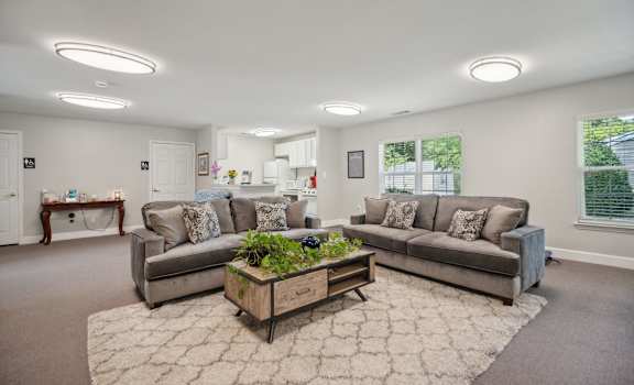 a living room with two couches and a coffee table