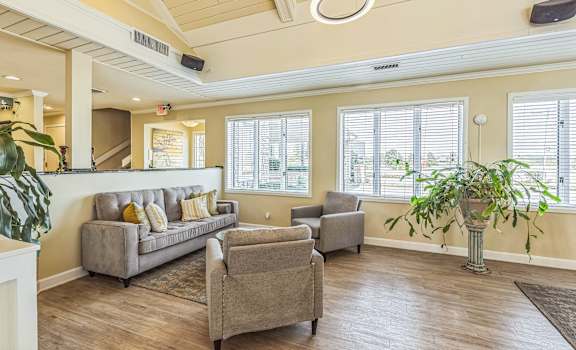 a living room with a couch and two chairs