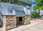 Thumbnail 4 of 20 - A stone structure with a sign that says "BAR" on it.