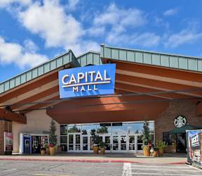 The entrance to the Capital Mall with a clear blue sky in the background.