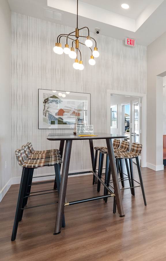 a kitchen with dark wood cabinets and white countertops  at Aventura at Hawk Ridge, Lake St Louis, 63367