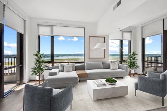 a living room with couches and chairs and a coffee table