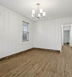 A white dining table with plates and glasses on it. at Shipyard Shores Apartments, Newport News, Virginia