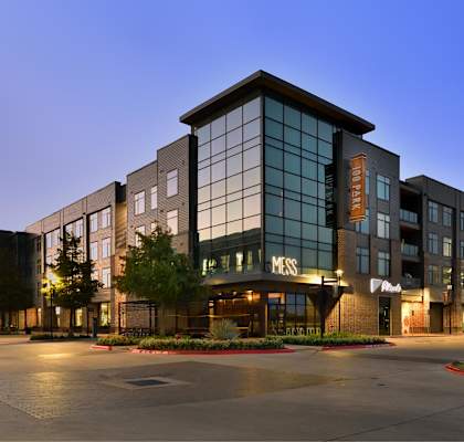 A large, modern building with the word "MERCY" on the front.