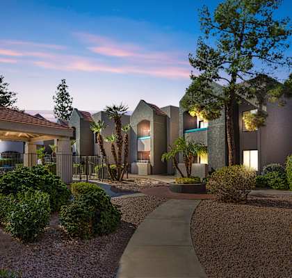 A modern residential area with a well-maintained garden and pathway.