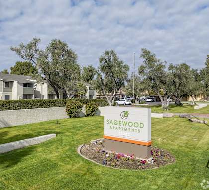 the sign for sagwood park at the entrance of the community