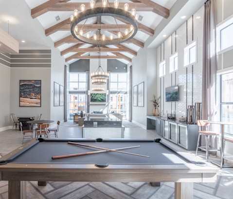 play a game of pool in the clubhouse at the preserve apartments