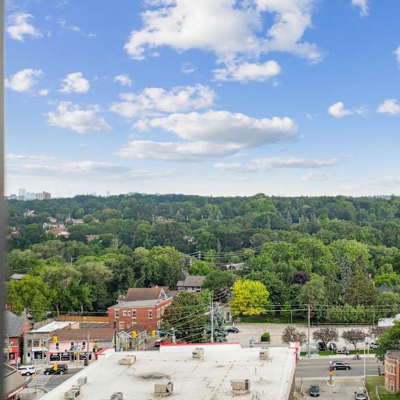 the view of the city from the roof of a building