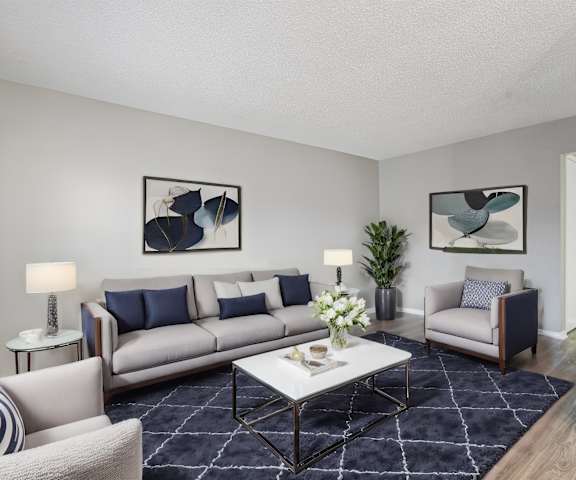a living room with a couch and a table and a television