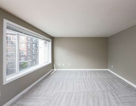 an empty room with a large window