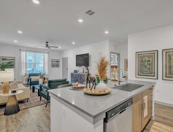 an open floor plan with a kitchen island and a living room at Canter Ocala, FL 34474