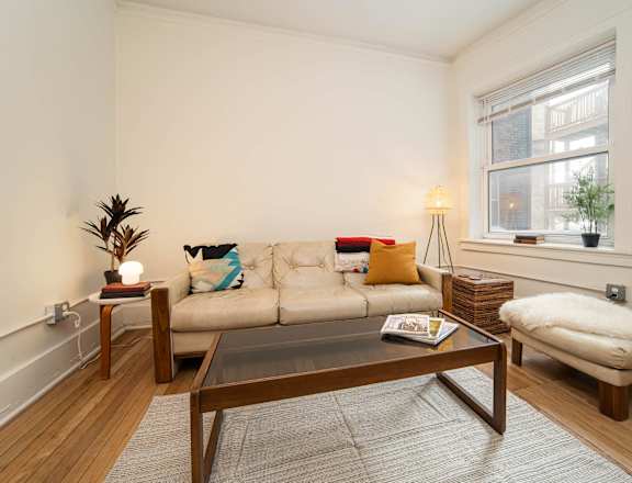 a living room with a couch and a table