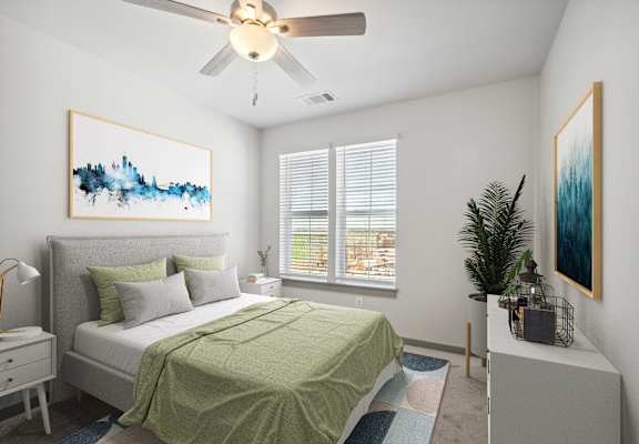 a bedroom with a green bed and a ceiling fan