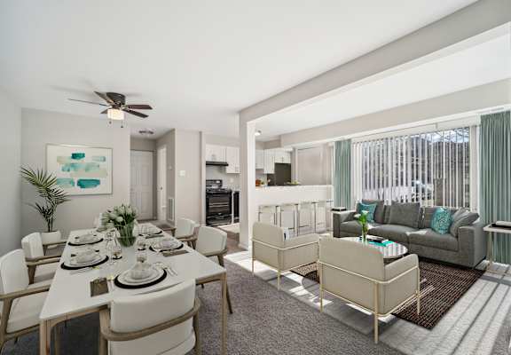 A dining room with a white table and chairs.