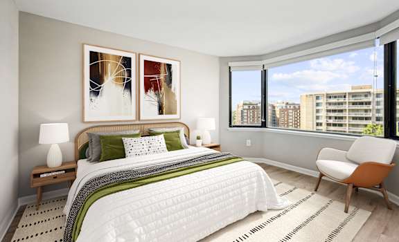 a bedroom with a large bed and a large window
