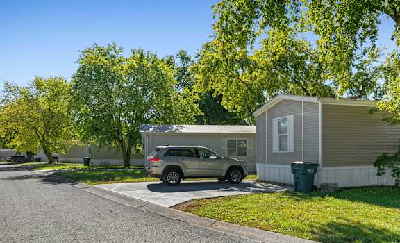 A car is parked in front of a house.