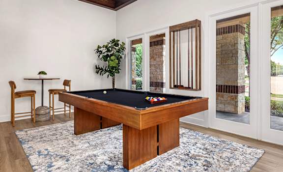a billiards table in a living room with a pool table