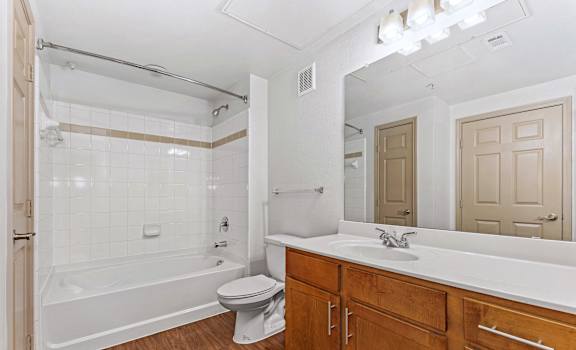 a bathroom with a sink toilet and a tub