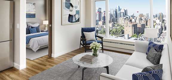 A modern living room with a view of the city skyline.