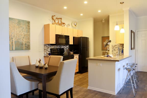 a kitchen and dining area in a 555 waverly unit